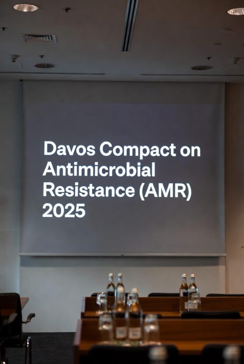 Context: Recently, the Davos Compact on Antimicrobial Resistance, supported by the Unified Coalition for the AMR Response, seeks to mobilise sustainable public and private financing to reduce global AMR deaths and save over 100 million lives by 2050. Key Highlights of the Davos Compact on Antimicrobial Resistance 2025 • The Compact calls for scaling up action in proportion to the global burden of antimicrobial resistance. • It seeks to reduce deaths linked to bacterial antimicrobial resistance by 10 percent by 2030. • The goal is to reduce global AMR deaths and save over 100 million lives by 2050. • It emphasises the One Health approach, integrating human, animal and environmental health. • It promotes sustainable financing mechanisms that combine public funding with private investment. • It supports revitalising antimicrobial research and development through push and pull incentives. • It encourages equitable and responsible access to new and existing antibiotics, diagnostics and vaccines. • It stresses infection prevention, control and antimicrobial stewardship across healthcare and food systems. About Antimicrobial Resistance (AMR) • Antimicrobials are medicines used to prevent and treat infectious diseases in humans, animals and plants. They include antibiotics, antivirals, antifungals, and antiparasitics. • Antimicrobial Resistance (AMR) occurs when bacteria, viruses, fungi and parasites no longer respond to antimicrobial medicines. • Infections become difficult or impossible to treat, increasing the risk of disease spread, severe illness, disability and death. • AMR is a natural process that happens over time through genetic changes in pathogens. However, its emergence and spread are accelerated by human intervention. o For example, multidrug-resistant tuberculosis (MDR-TB) is a form of TB caused by bacteria that do not respond to isoniazid and rifampicin, the two most effective first-line TB drugs. Causes of AMR Spread • Inappropriate use of antimicrobials: The misuse and overuse of antimicrobials in humans, animals and plants are the main drivers. • Poor Infection prevention and control (IPC) practices in hospitals: Provides more opportunity for resistant bacteria and other germs to spread. • Lack of enforcement and compliance with existing regulations: For example, the release of improperly treated hospital waste and effluents spreads antimicrobial-resistant organisms to the adjacent environment. • Farming practices: Such as the practice of adding antibiotics to agricultural feed accelerates the process of AMR. Measures Taken Against AMR Initiatives in India • National Programme on AMR Containment: Established the National Antimicrobial Surveillance Network (NARS-Net) to determine the magnitude and trends of AMR in different geographical regions of the country. • National Centre for Disease Control (NCDC): It has published the National Treatment Guidelines for Antimicrobial Use in Infectious Diseases. • Red Line awareness campaign on Anti-Microbials Resistance: Launched by the Ministry of Health and Family Welfare (MoHFW), it urges people not to use medicines marked with a red vertical line, including antibiotics, without a doctor’s prescription • National Action Plan for containment of AMR (NAP-AMR): Focuses on an integrated One Health approach and involves coordination among various sectors at the state, national and international levels